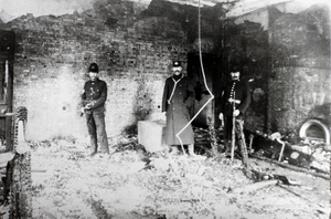Policemen in a fire damaged room, Louza Police Station, Shanghai